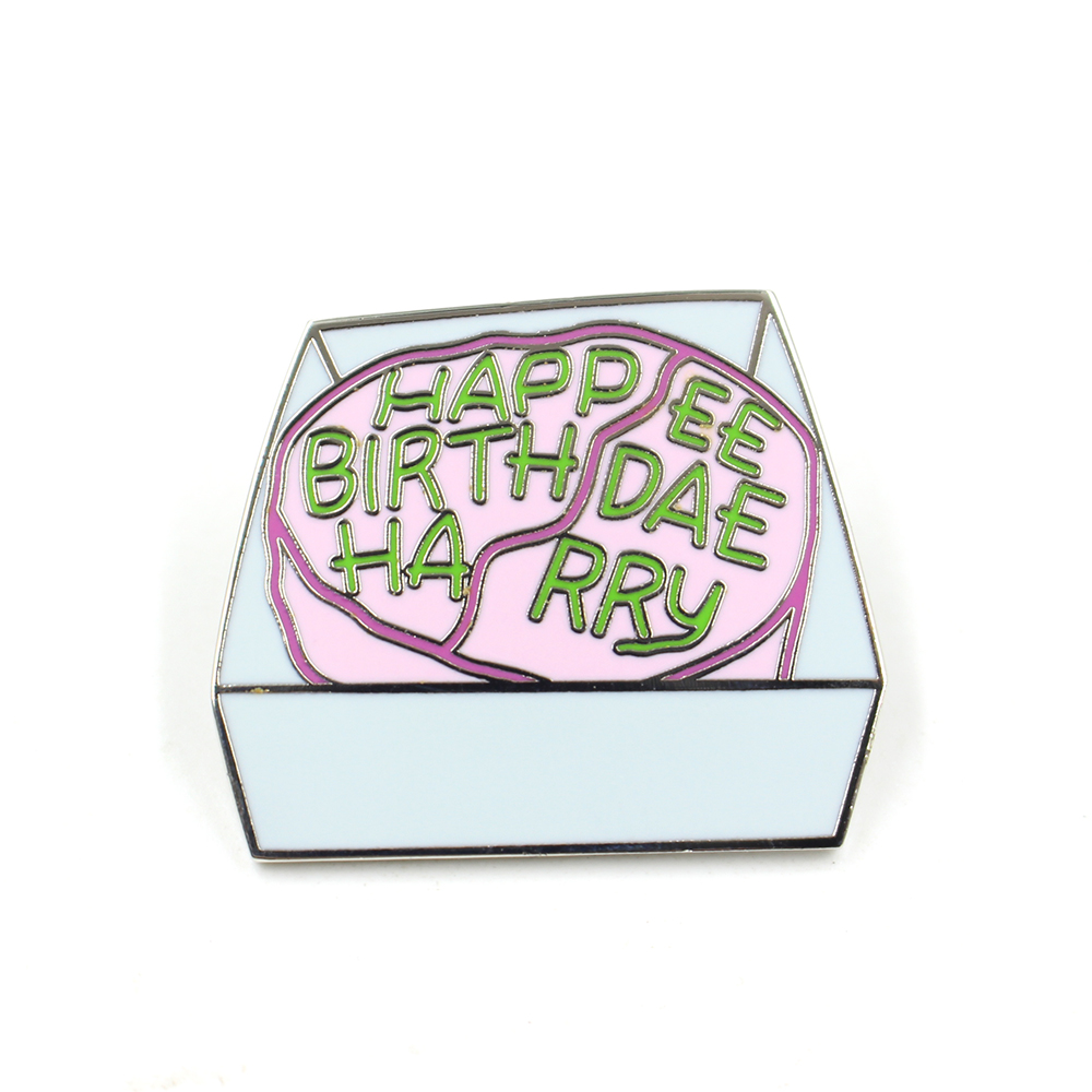 ard enamel pin of a cracked pink Happy Birthday cake IMG_4866